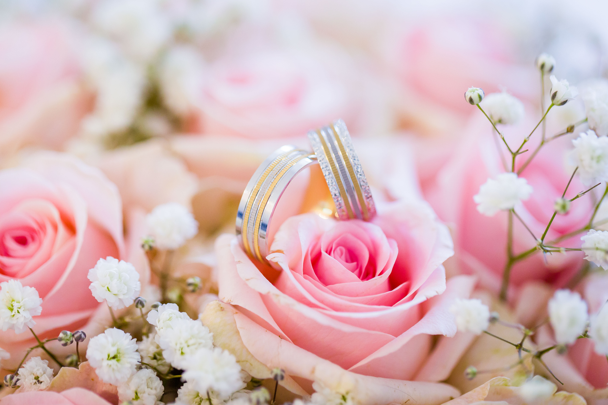 Close up of beautiful wedding ring on bridal bouquet.